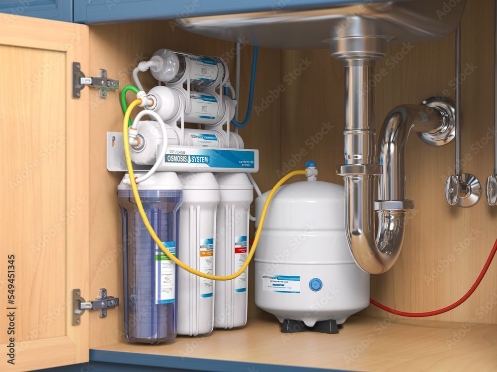 Reverse osmosis water filter system under a kitchen sink.