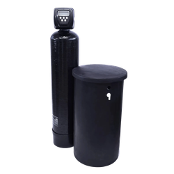 A black water softener is sitting next to a black tank.