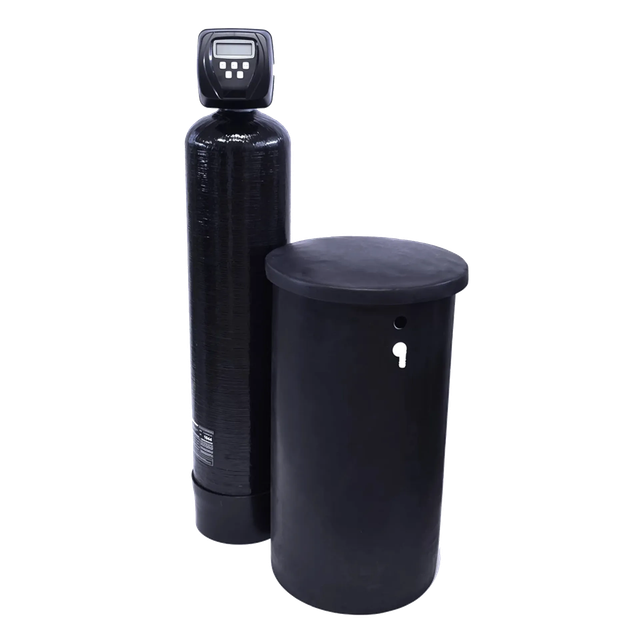 A black water softener is sitting next to a black tank.