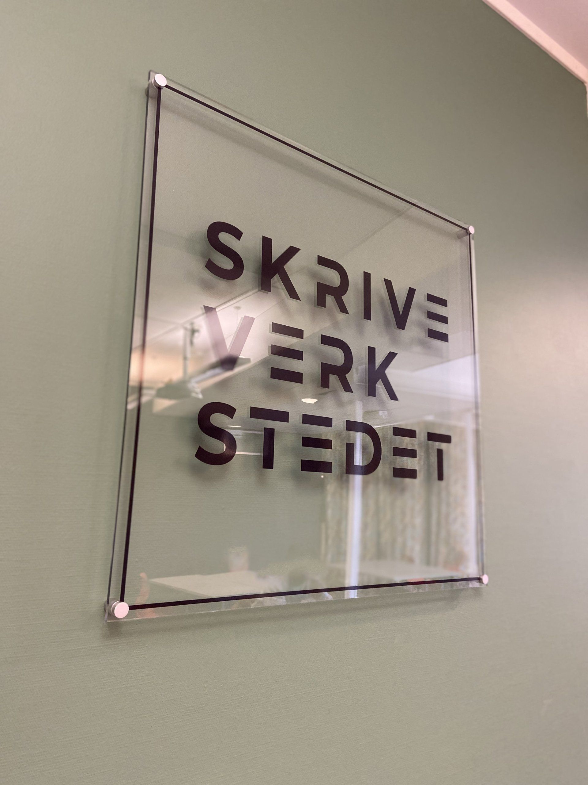 A sign on a wall that says 