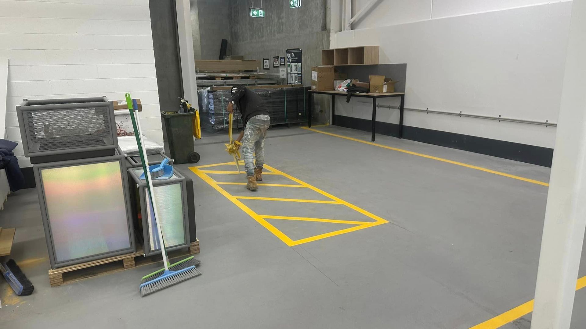 A warehouse with a yellow line on the floor.