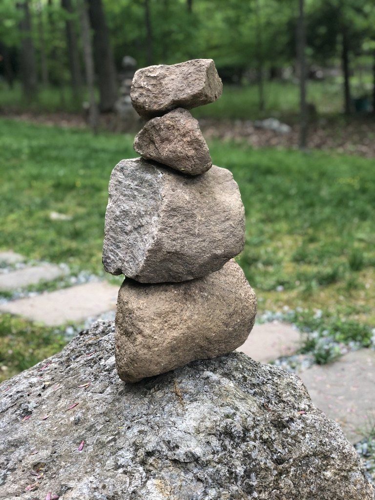 A pile of rocks stacked on top of each other on top of a rock.
