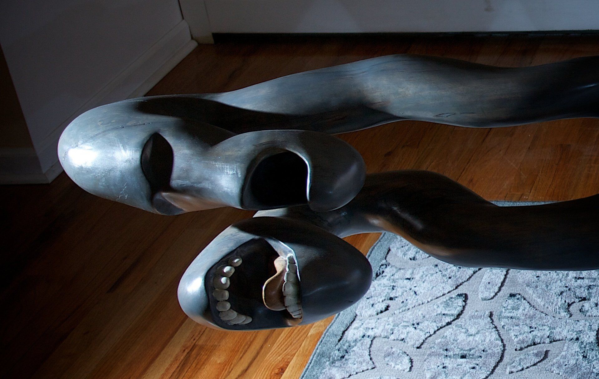 A close up of a sculpture on a wooden floor