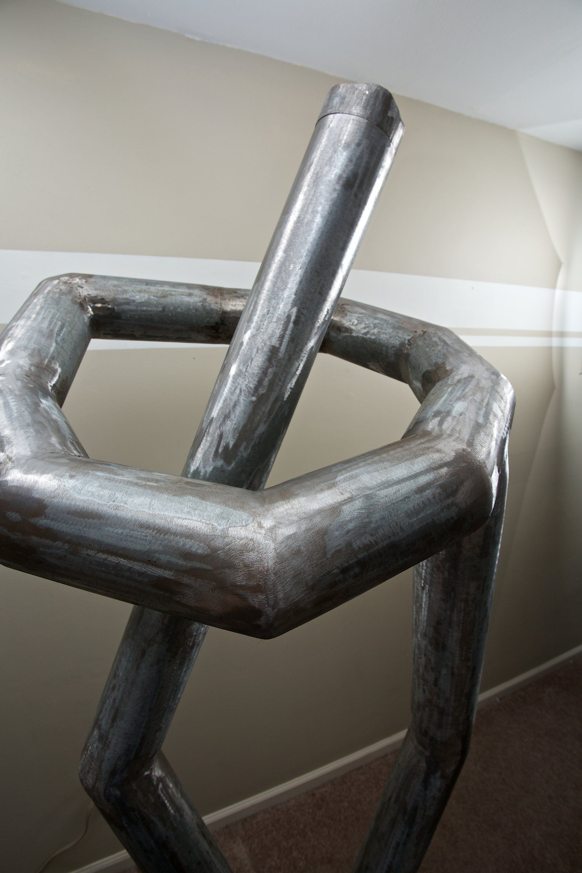 A close up of a metal sculpture in a room