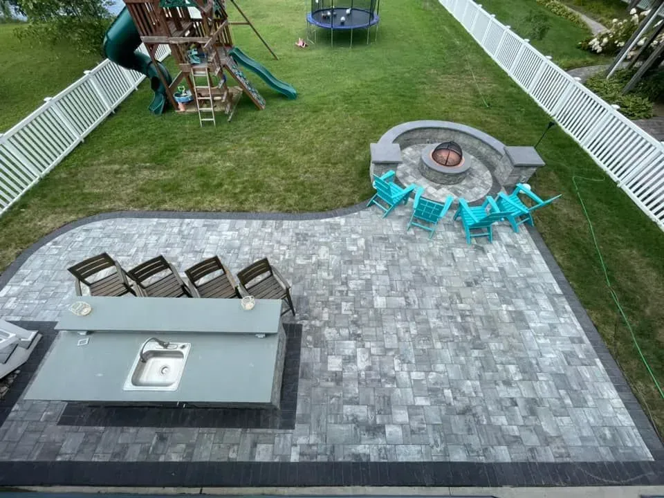 Overhead view of a custom patio in Maryland with outdoor kitchen and fireplace
