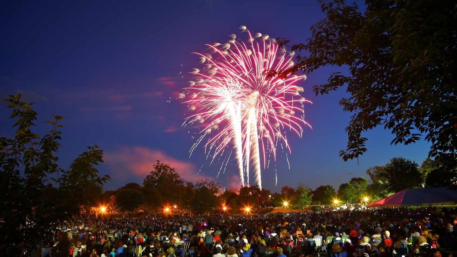 Colorful Fourth of July fireworks lighting up the night sky over a Maryland community celebration.