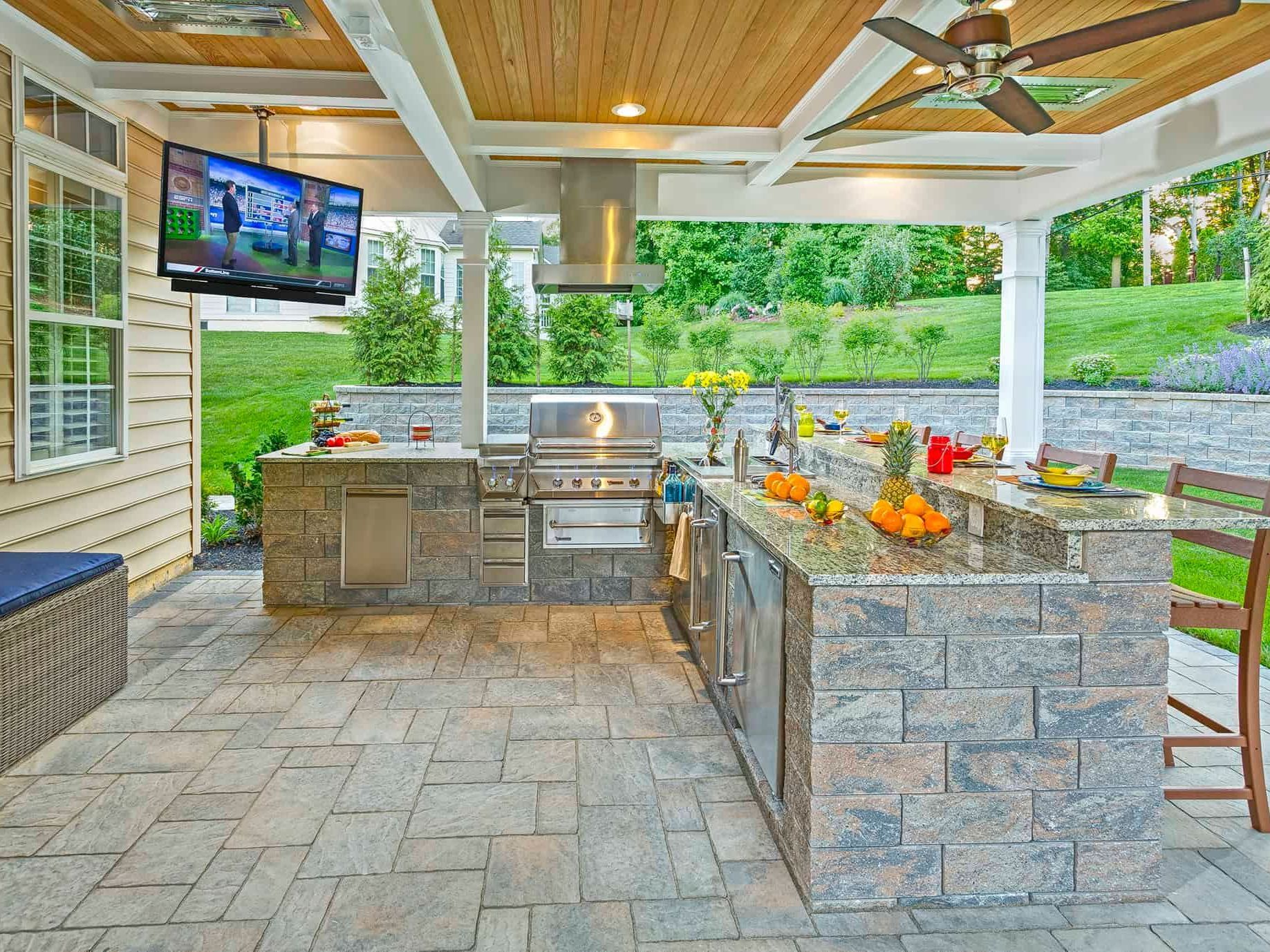 Modern outdoor kitchen with stainless steel appliances and a paver patio | Xscape 2 Nature, Maryland