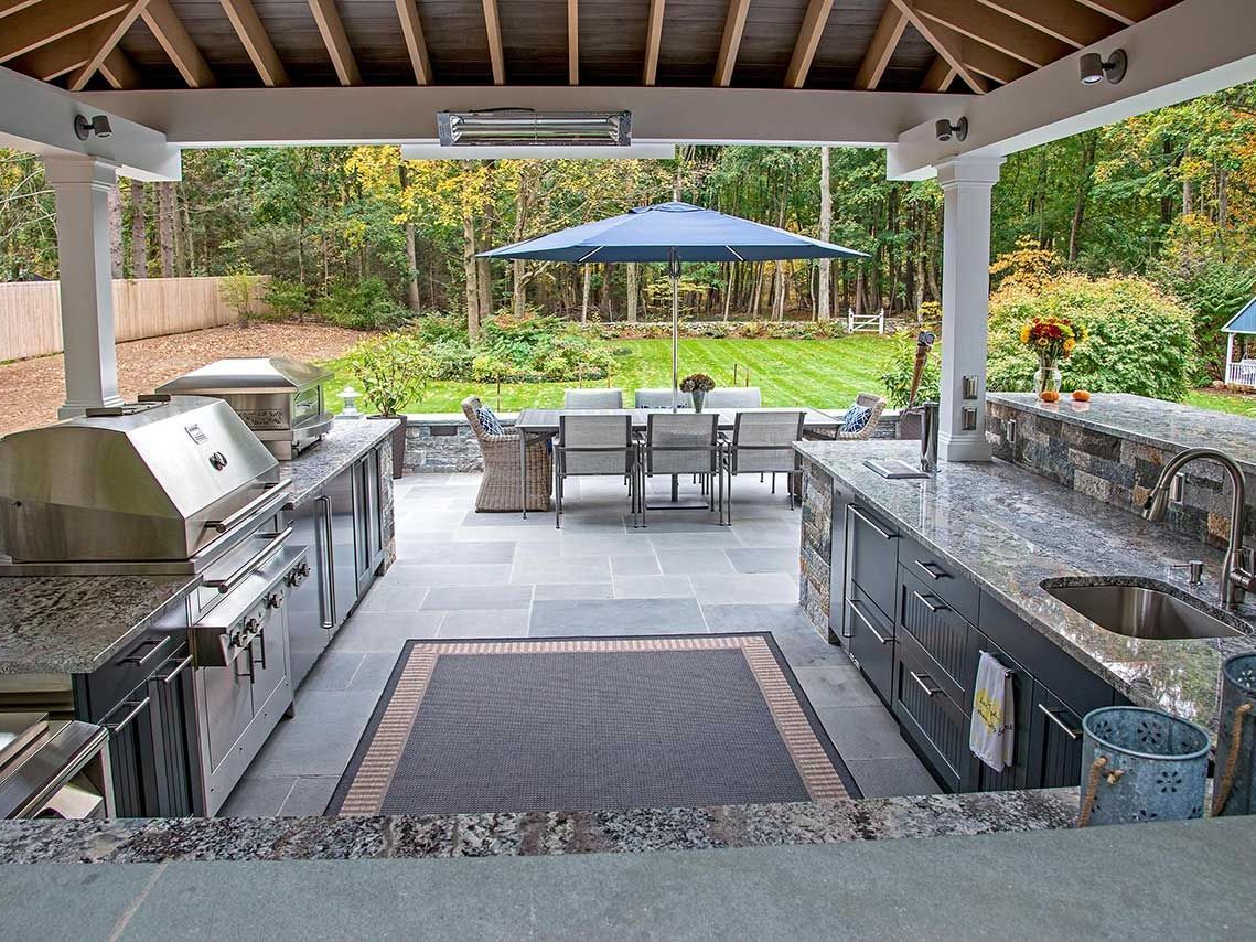 Custom outdoor kitchen and patio combo with built-in grill and stone pavers | Xscape 2 Nature, Maryland