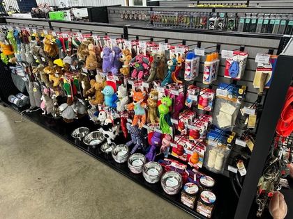 Two gray and tan portable buildings with doors and metal diamond plate trim.