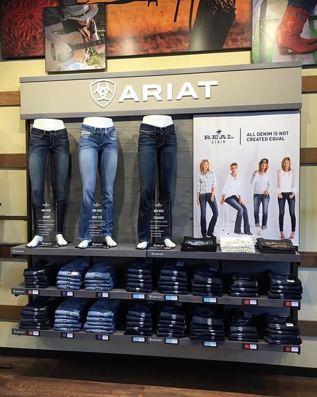 A display of ariat jeans in a store