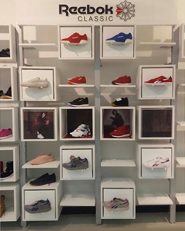 A display of reebok classic shoes in a store