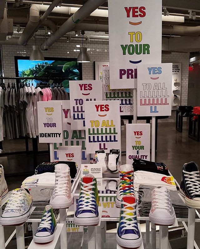 A display of shoes with signs that say yes to your identity