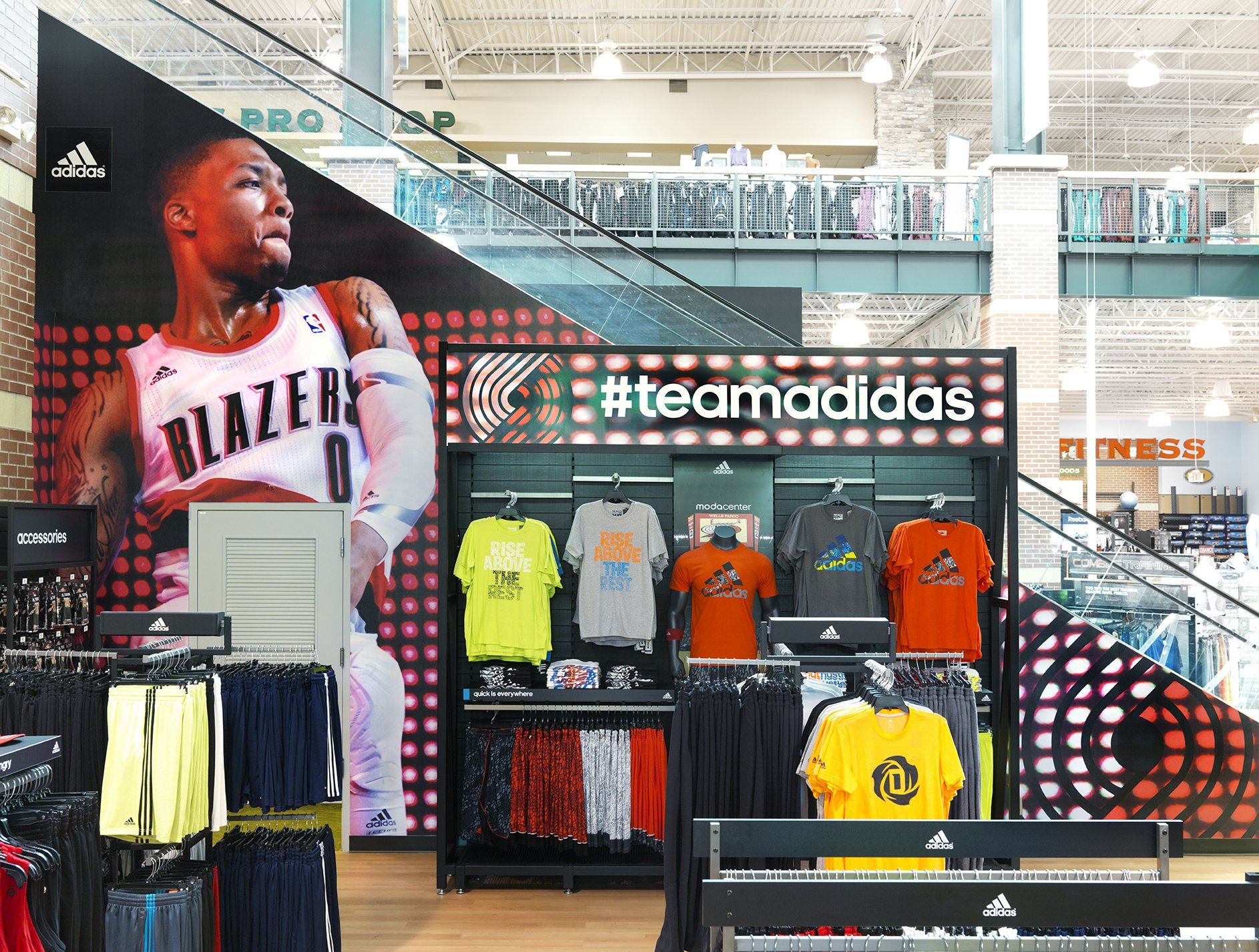 A basketball player is hanging on a wall in a store.