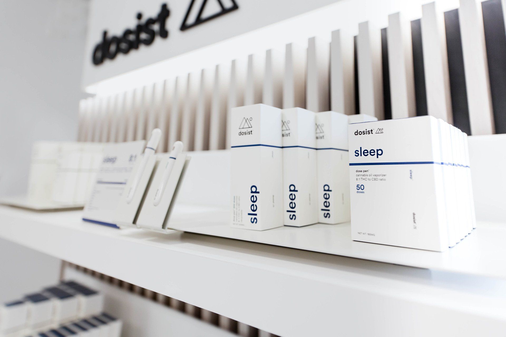 A shelf full of boxes that say sleep on them