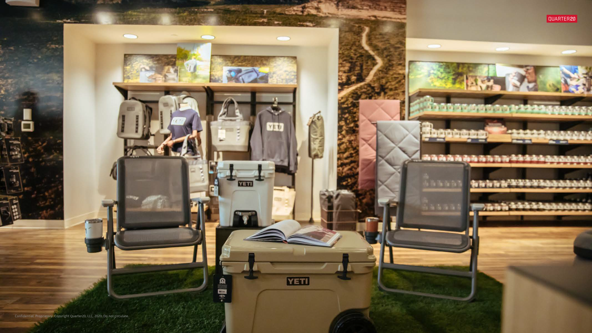 There are two chairs and a cooler in the middle of the room.