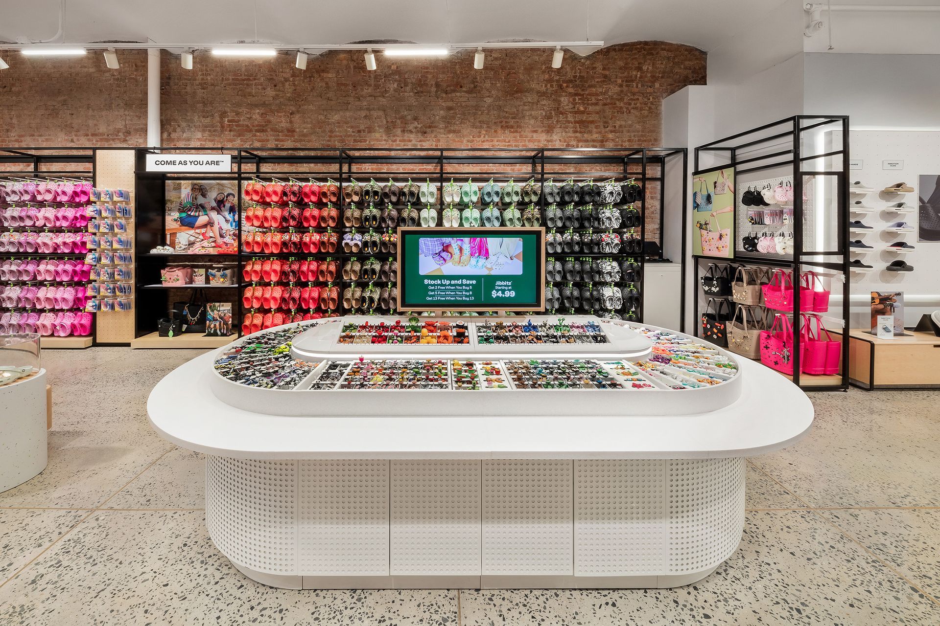 Sunglasses display in a store, showcasing various styles and colors.
