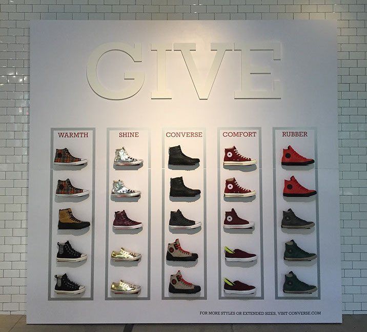 A display of shoes with the word give above them