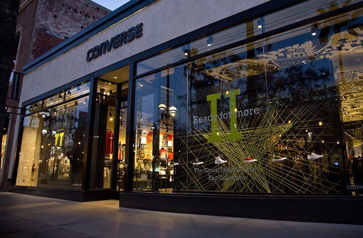 A converse store is located on a city street.