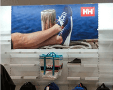 A store display with a picture of a person 's feet on a boat.