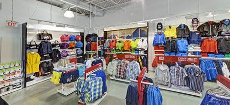 A store filled with lots of clothes and bags.