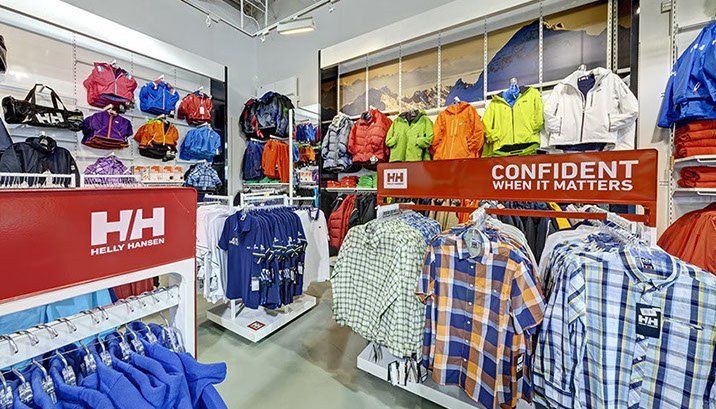 A store filled with clothes and a sign that says `` confident when it matters ''.