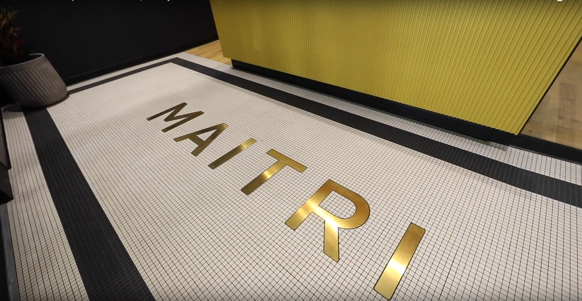 The word maitri is on the floor in gold letters