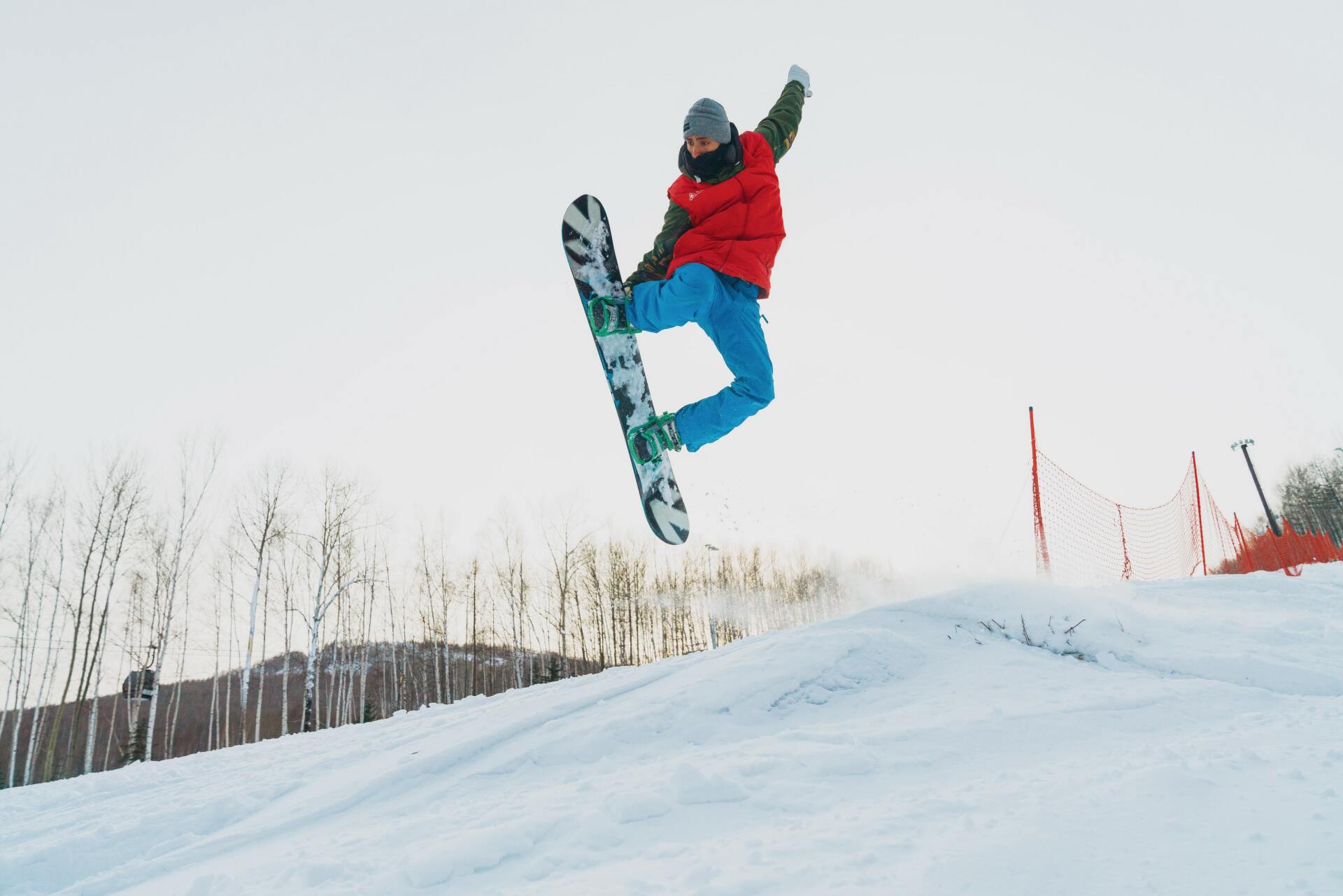 a snowboarder doing an aerial trick