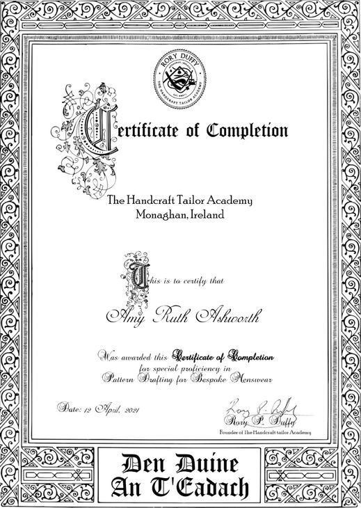 A black and white certificate of completion with a floral frame