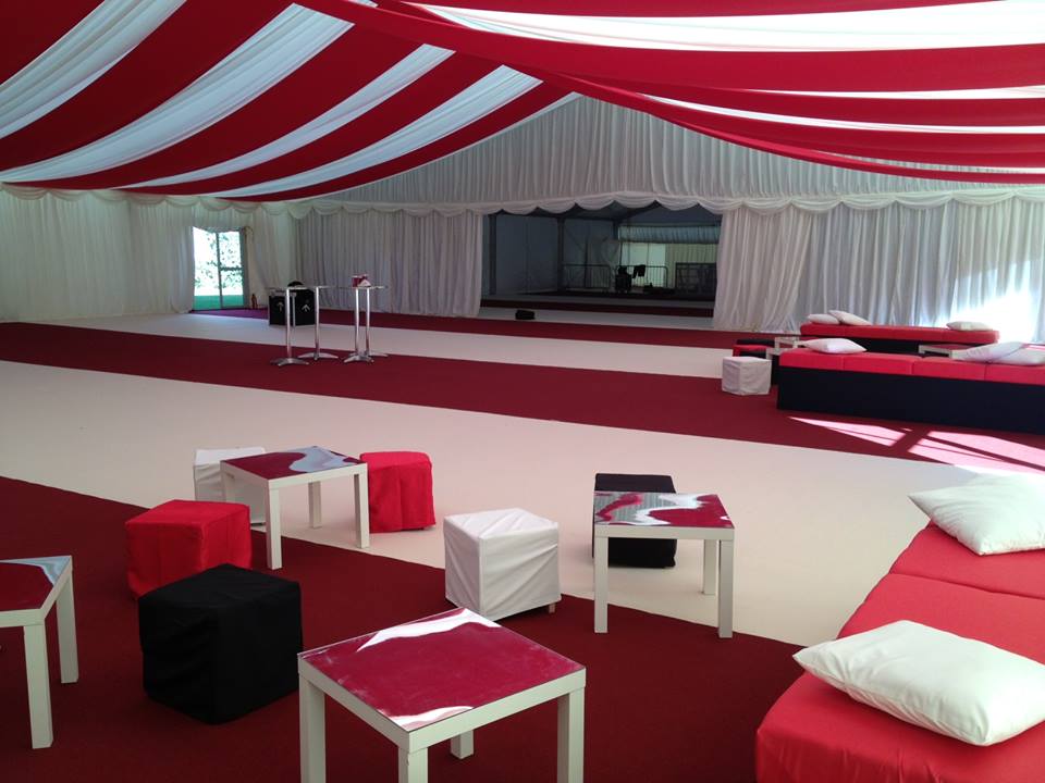 A large room with red and white stripes on the ceiling