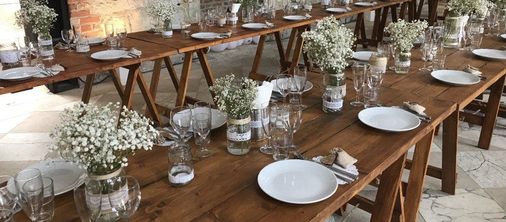 heavy duty a-frame trestle tables set in rows for a wedding banquet