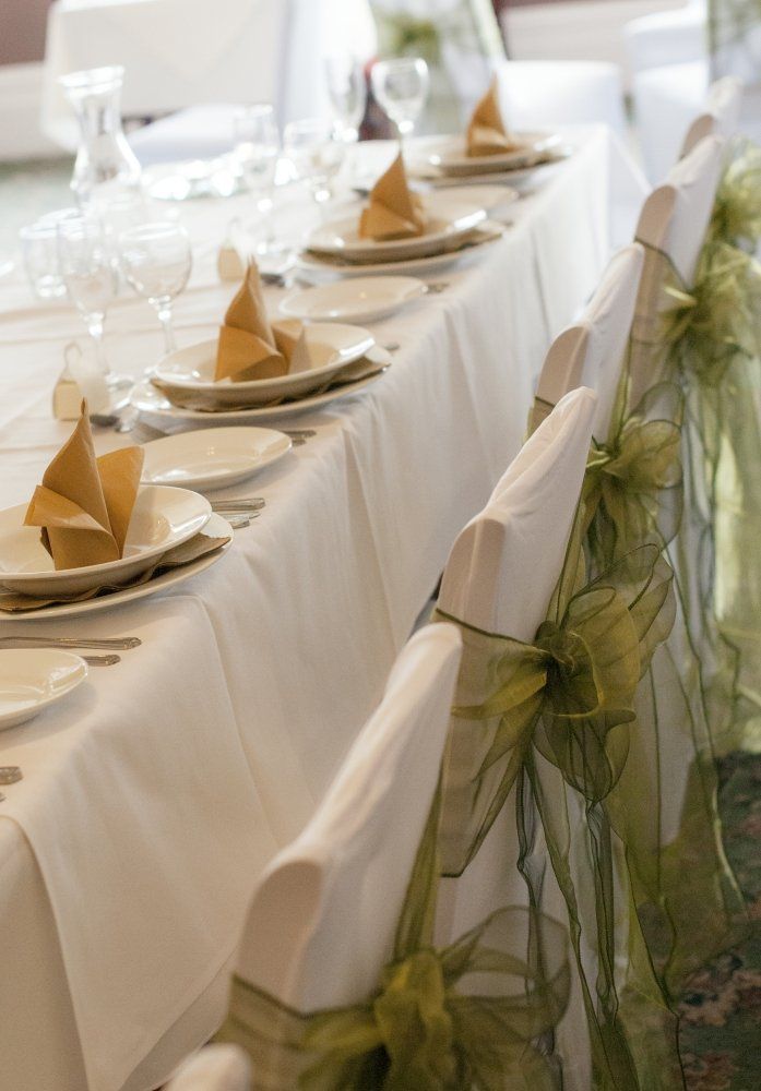 A long table with plates and napkins on it