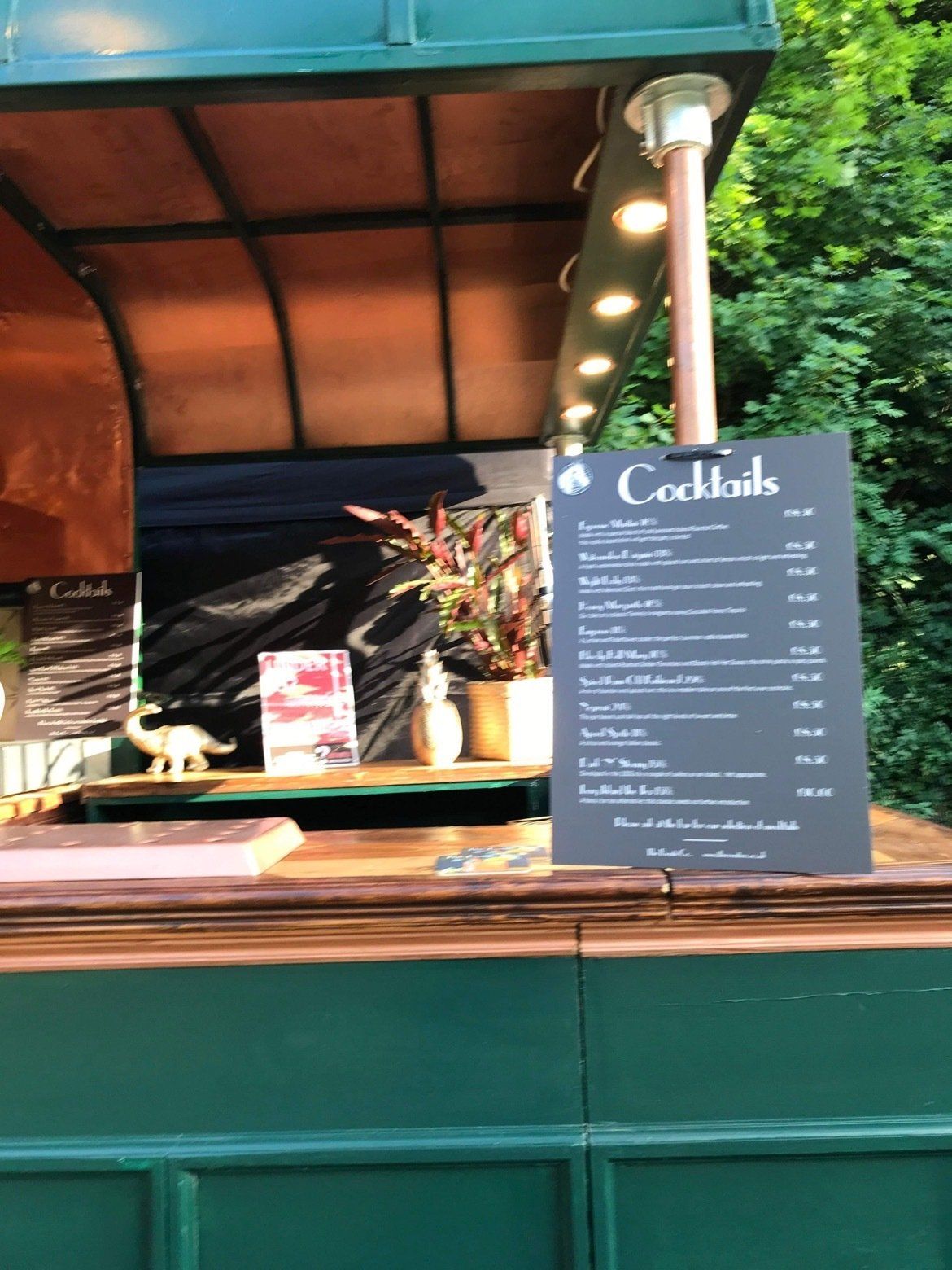 A bar with a sign that says cocktails on it