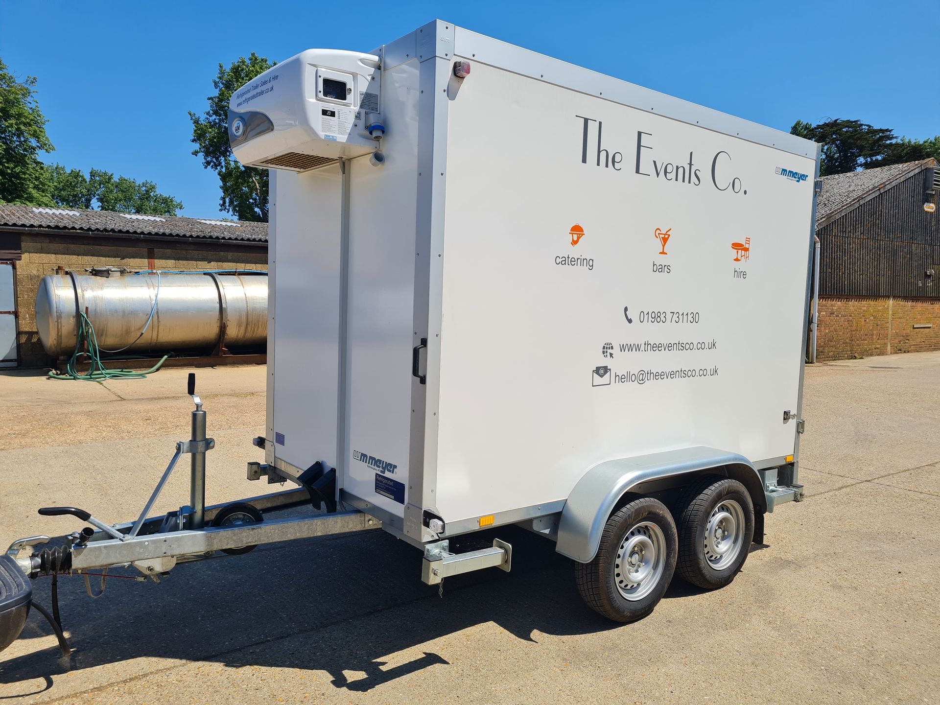 A white trailer with the event 's co. written on it