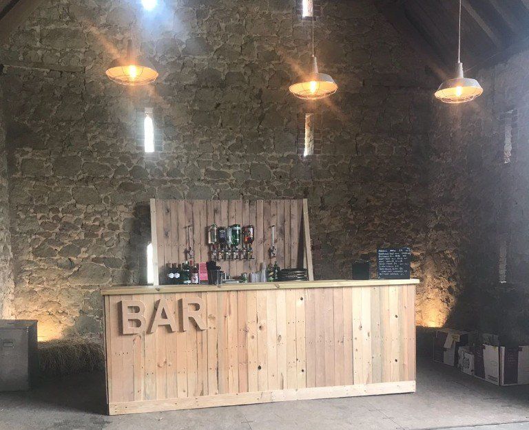 A wooden bar with the word bar written on it