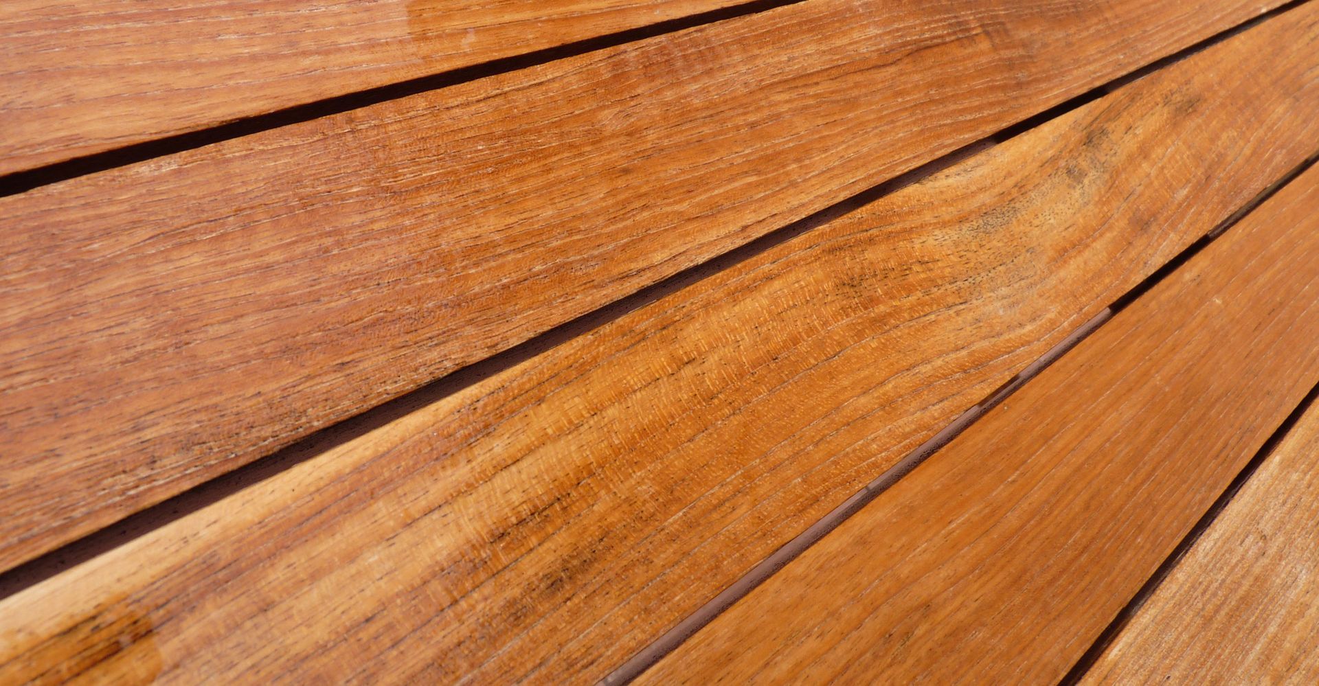 A close up of a wooden deck with a few lines on it.