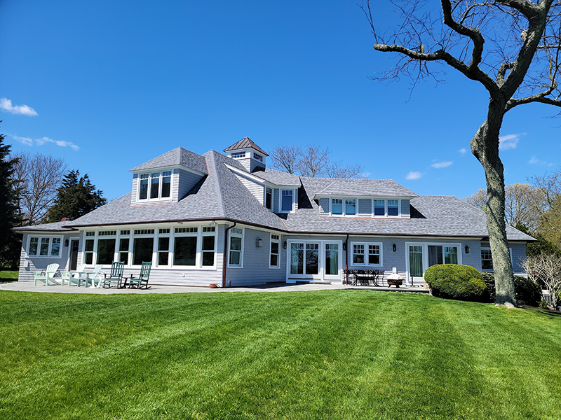 A large house with a large lawn in front of it