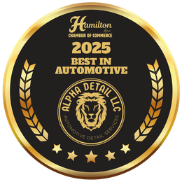 A gold medal with a lion on it that says best in automotive