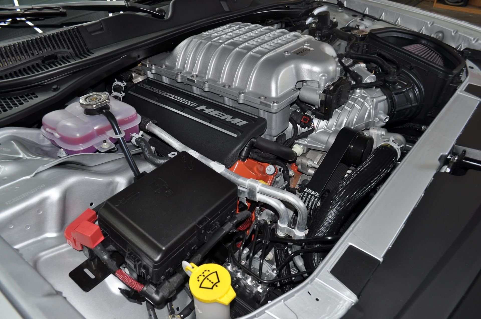 A close up of the engine of a dodge charger