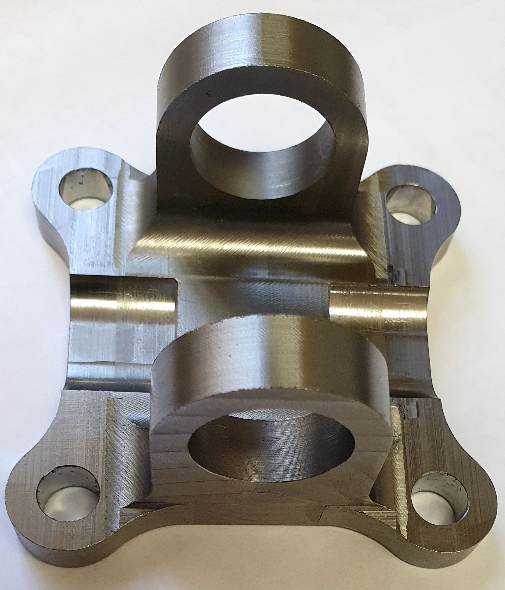 A piece of metal with a hole in the middle