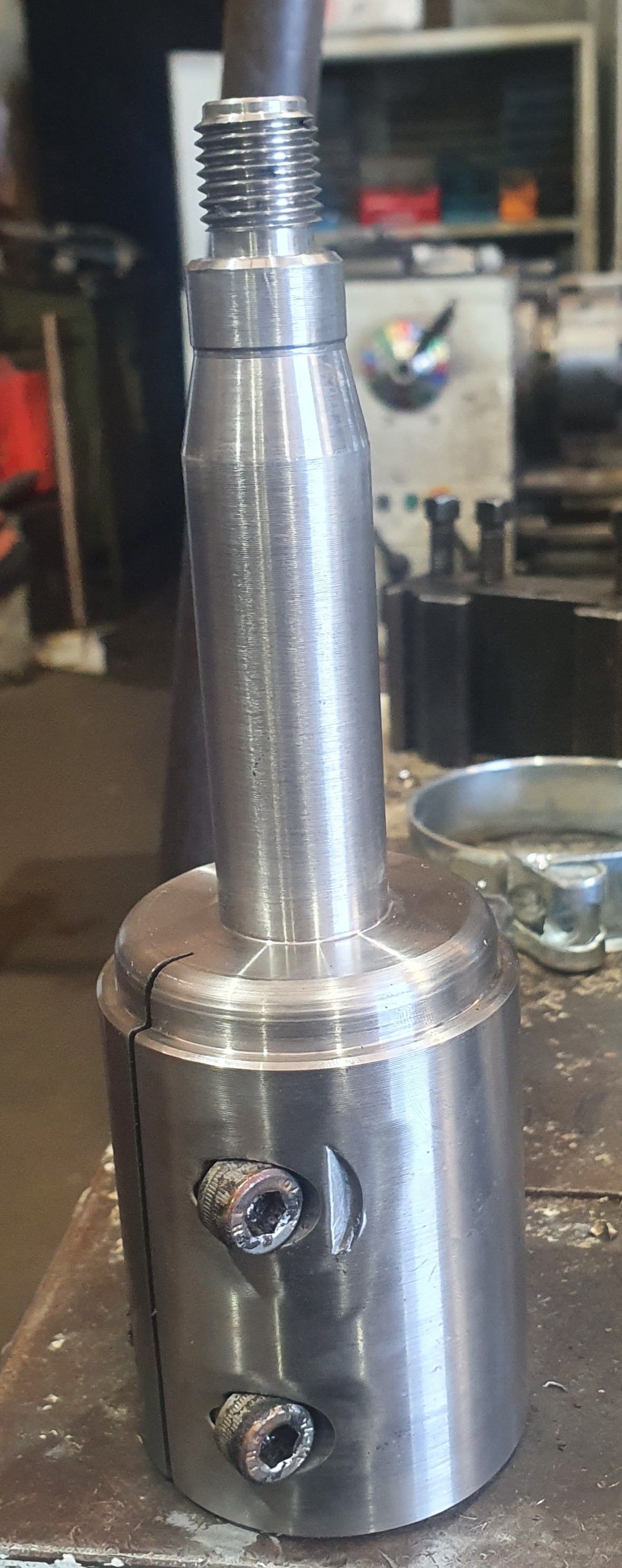 A close up of a metal object sitting on top of a table.