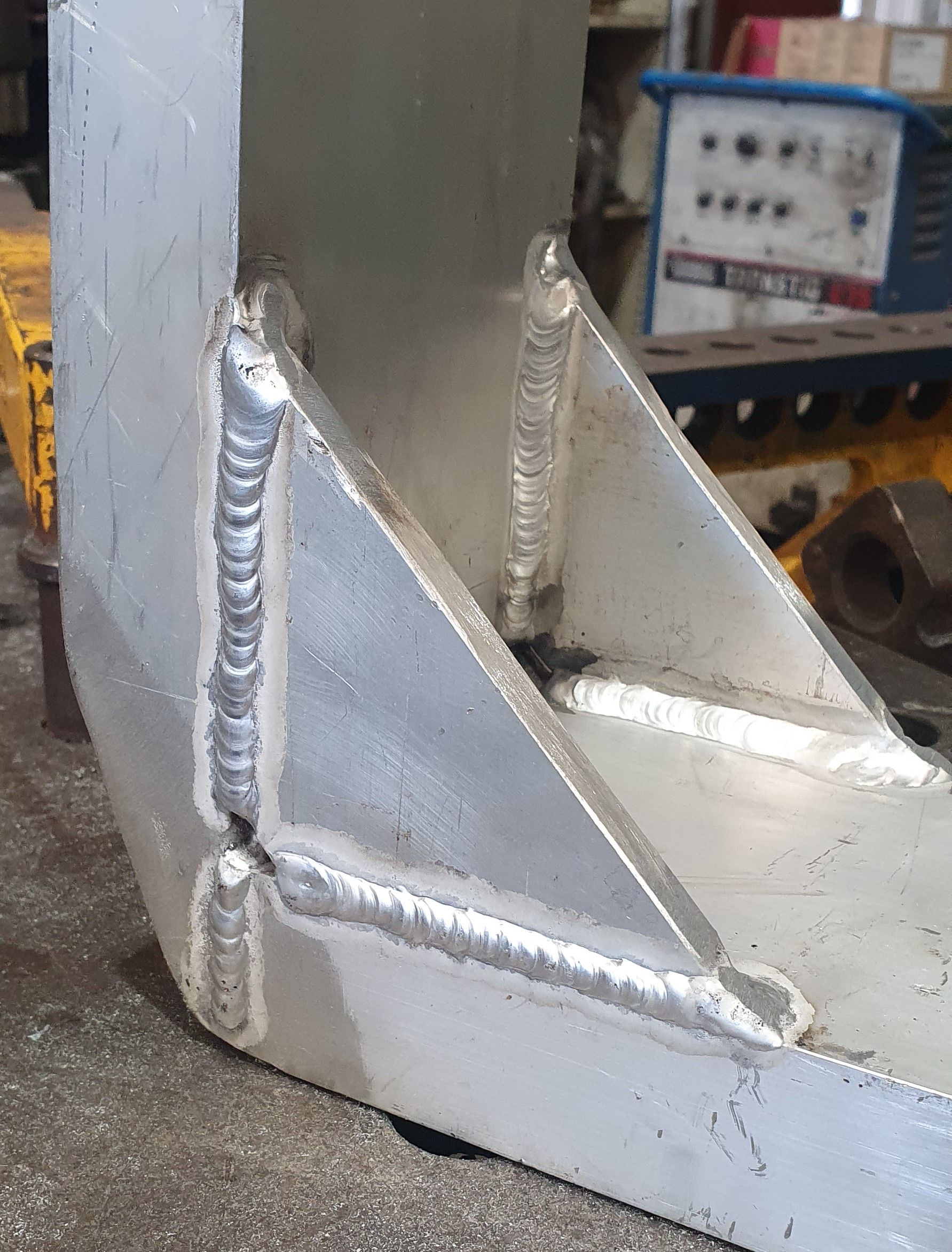 A close up of a piece of metal with welding on it.