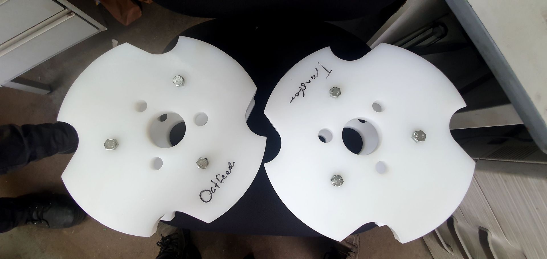 Two pieces of plastic with arabic writing on them