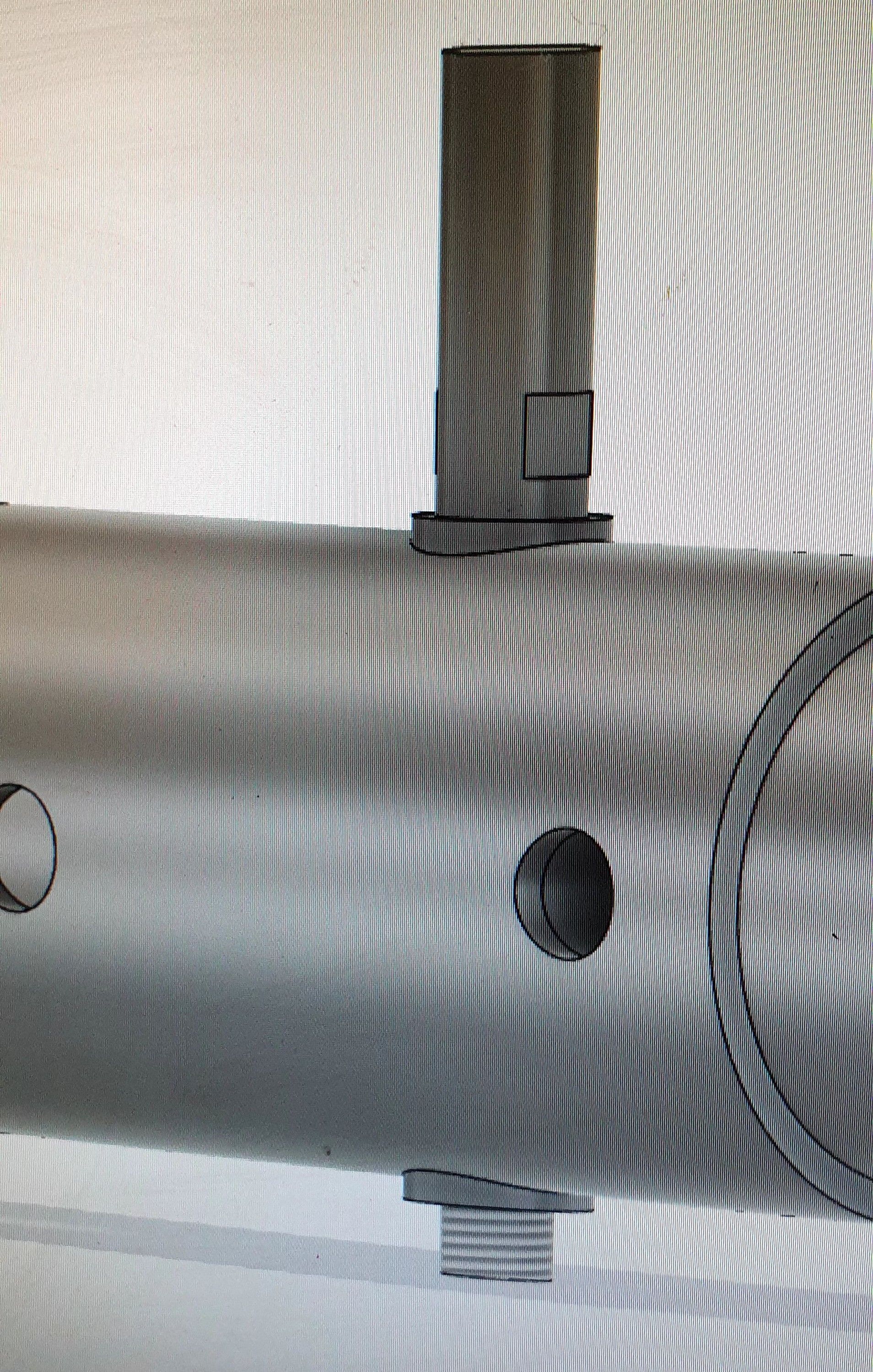 A black and white photo of a metal pipe with a hole in the middle.