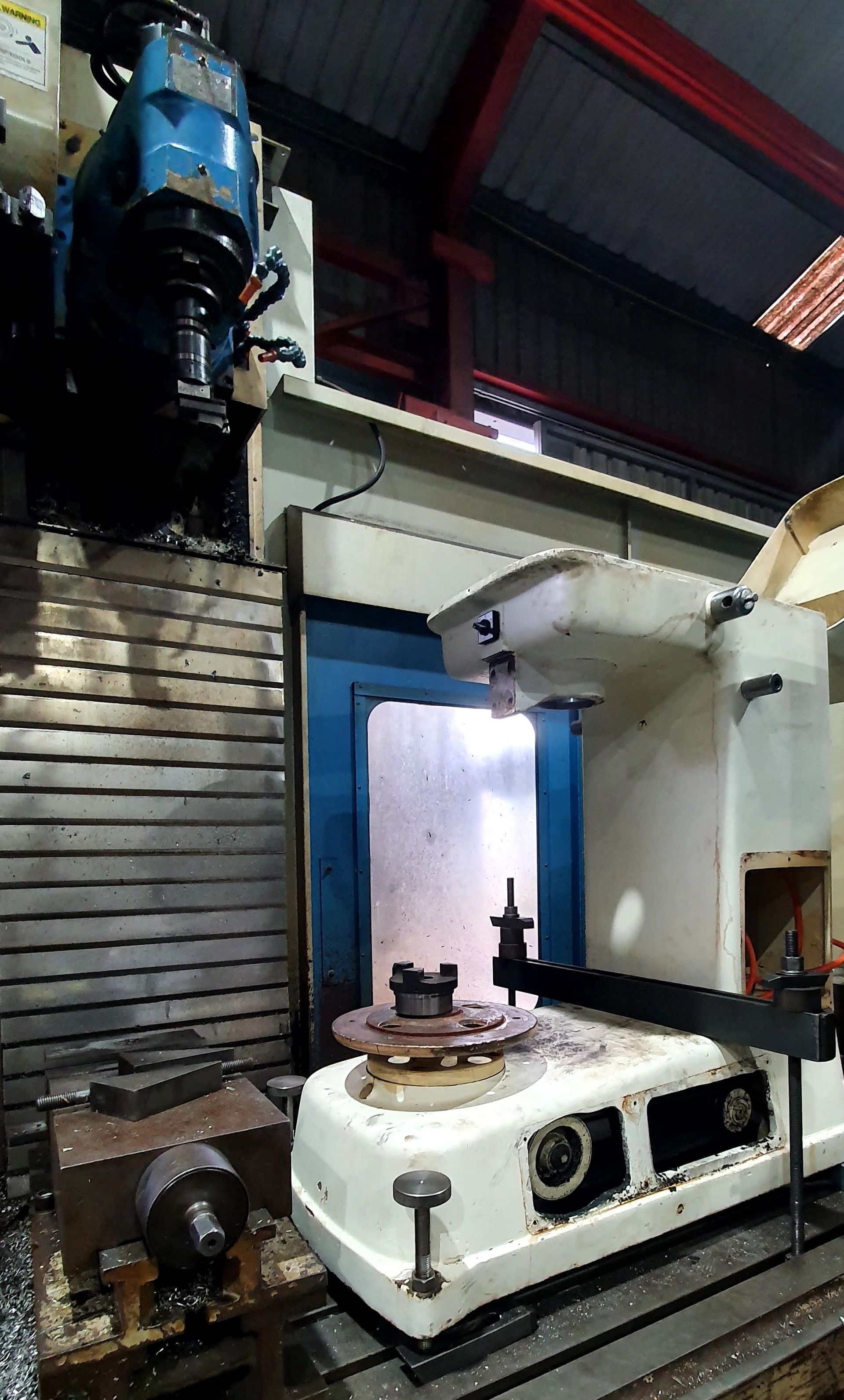 A machine is sitting on top of a table in a factory.