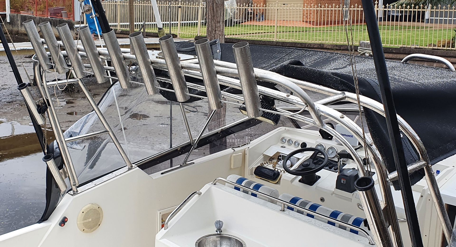 A boat with a lot of fishing rods on it