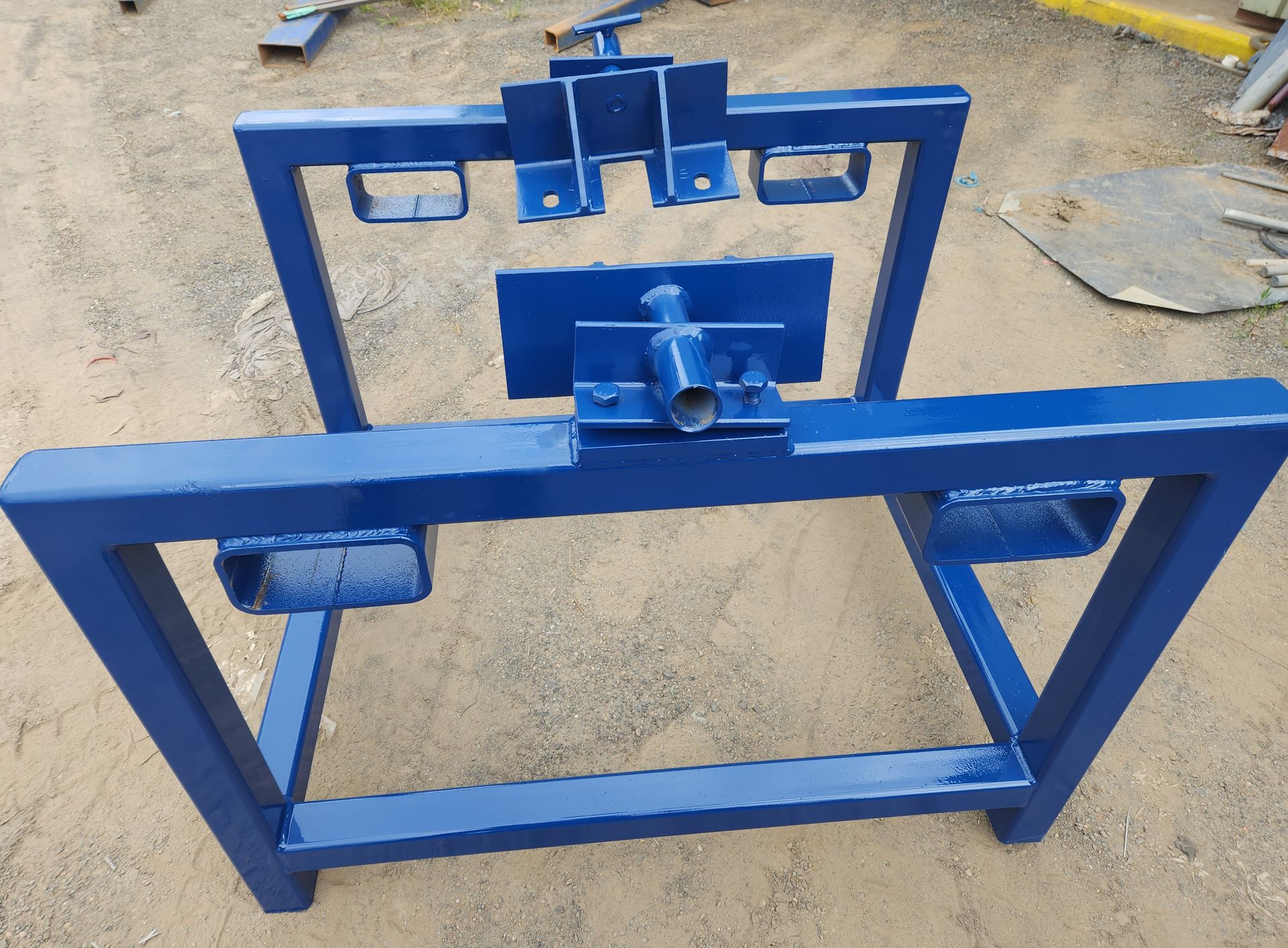 A blue metal frame is sitting on the ground