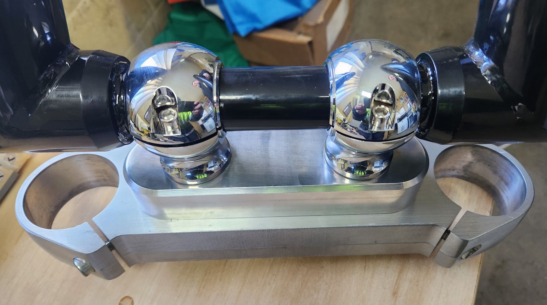 A close up of a metal object on a wooden table