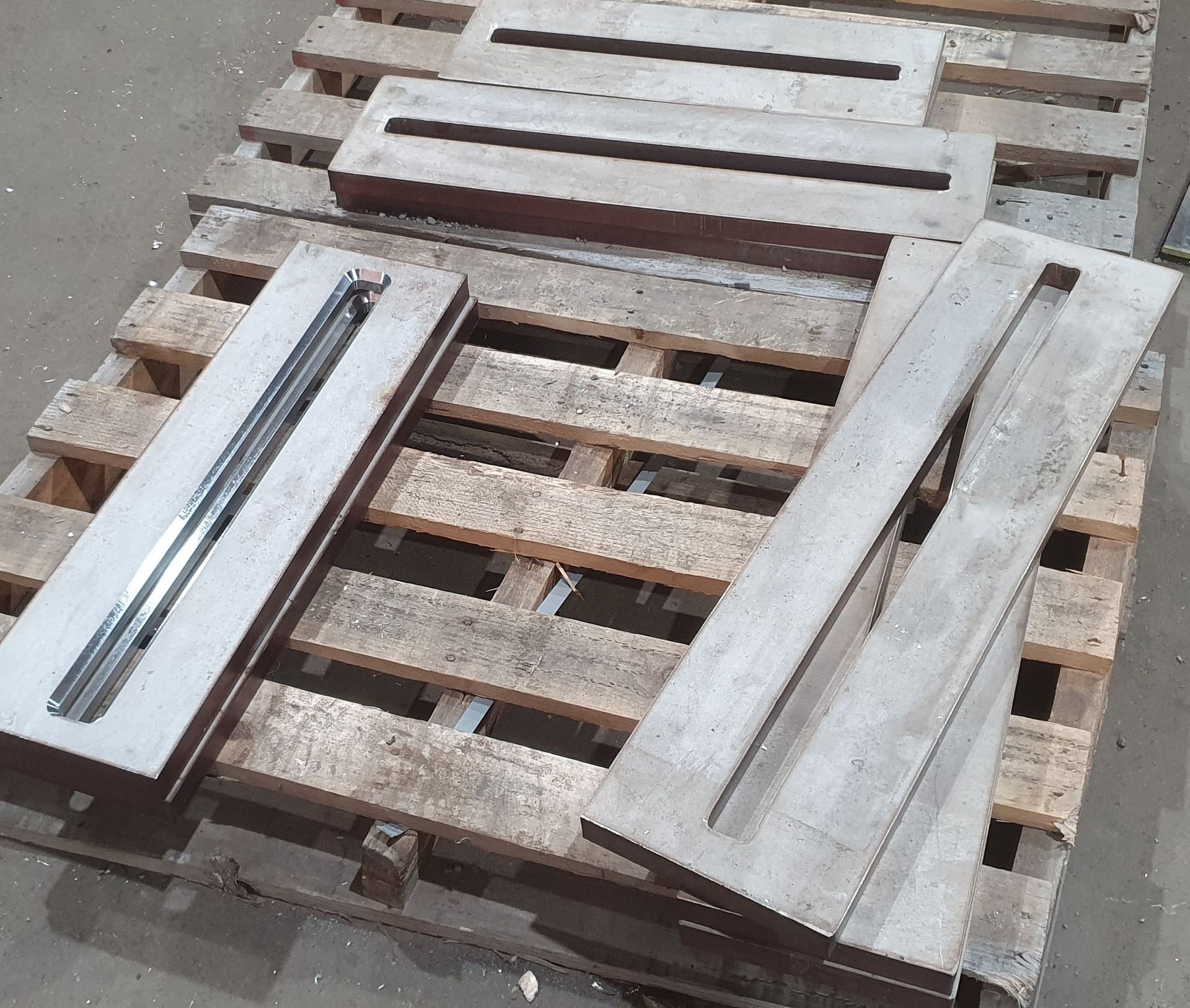 A bunch of wooden pallets are stacked on top of each other