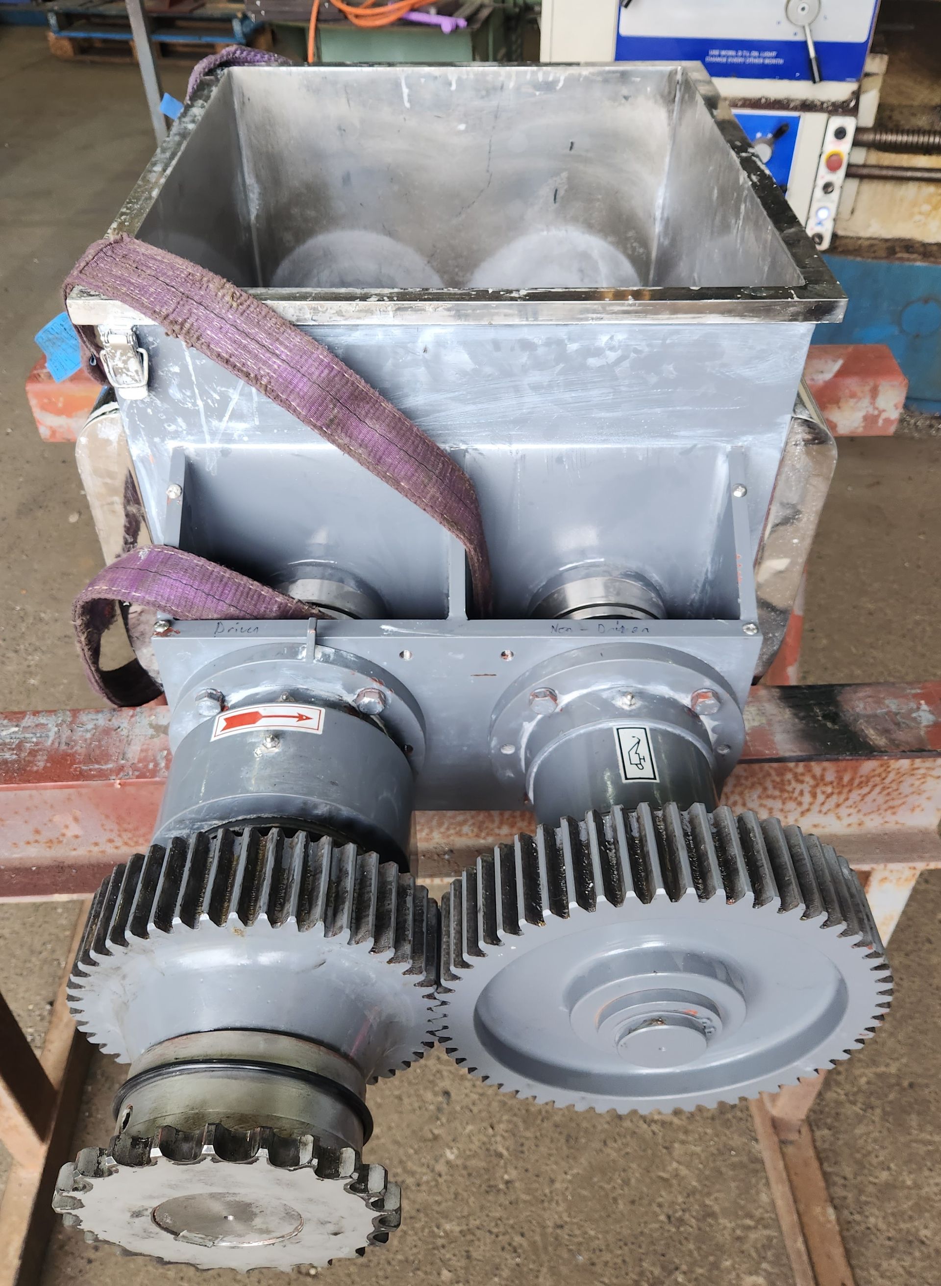 A machine with gears on it is sitting on a table.