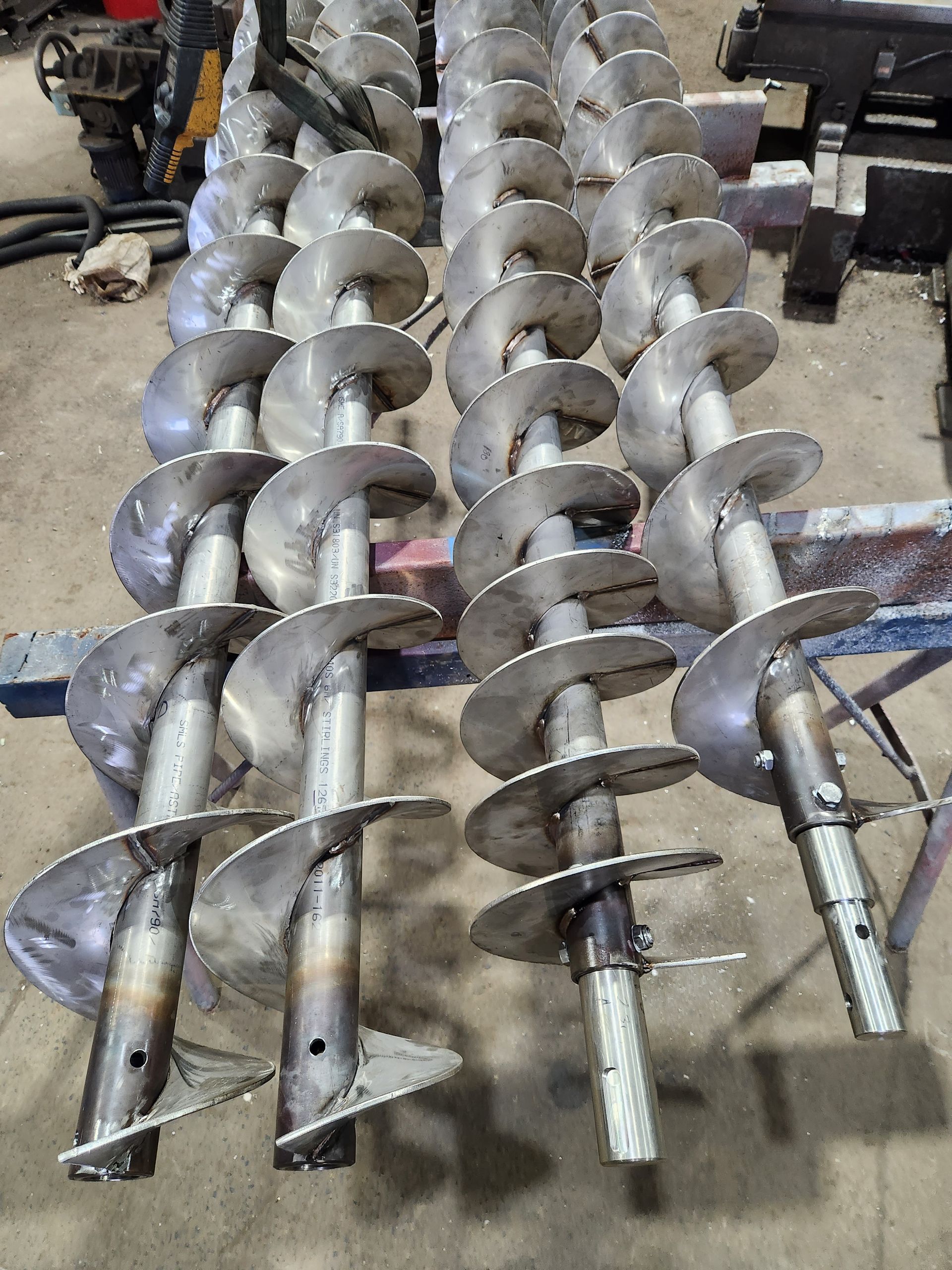 A bunch of metal spirals are sitting on a table.